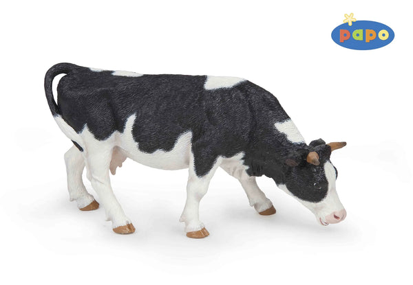 Figurine - Black And White Grazing Cow